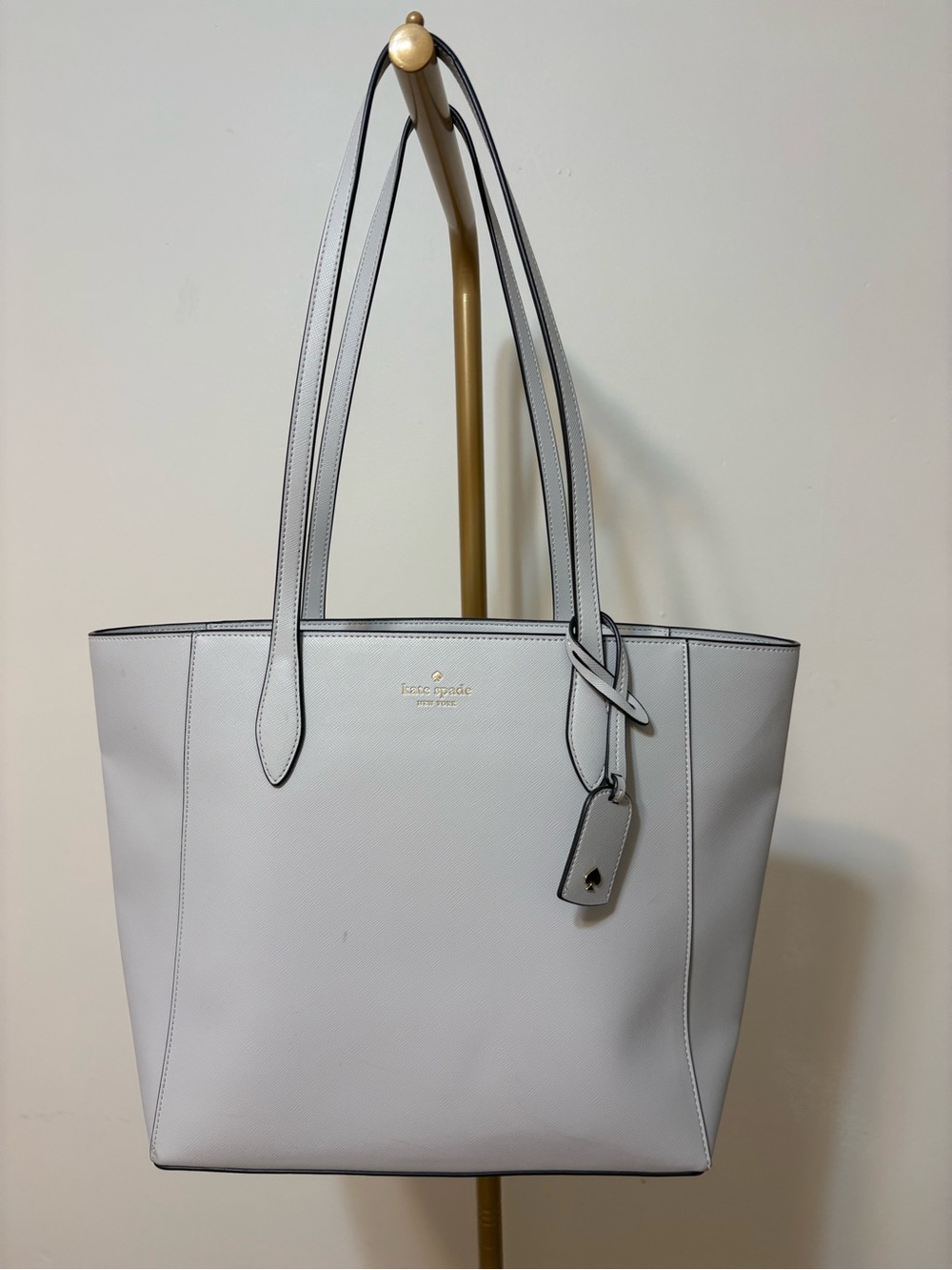 Kate Spade light gray leather-like tote with gold hardware